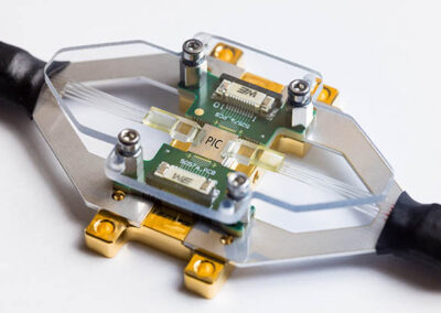 PHIX Characterization Package with grating coupled recessed lid fiber arrays